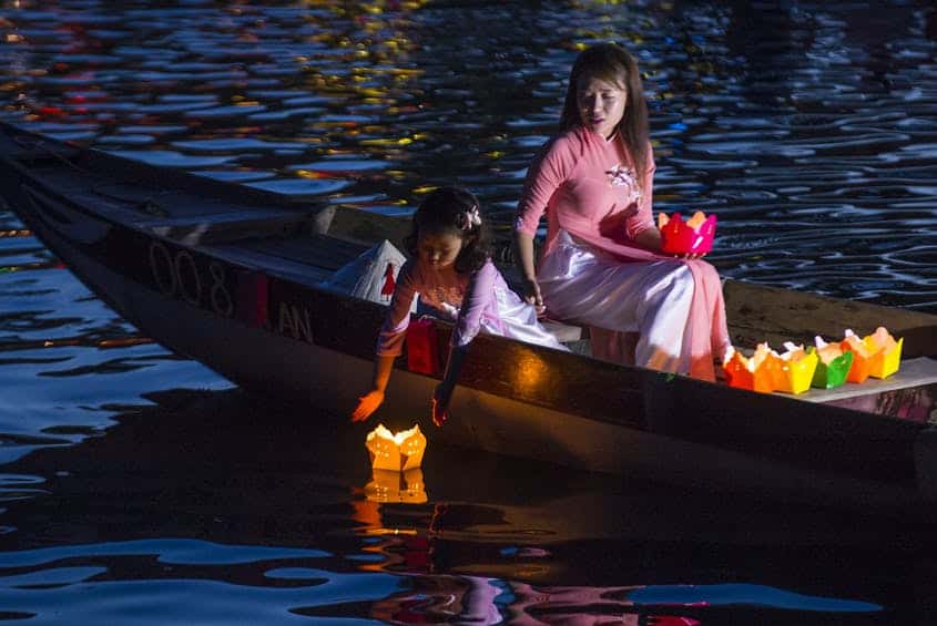 Dropping Lanterns from a Boat - activities in Hoi An lantern festival