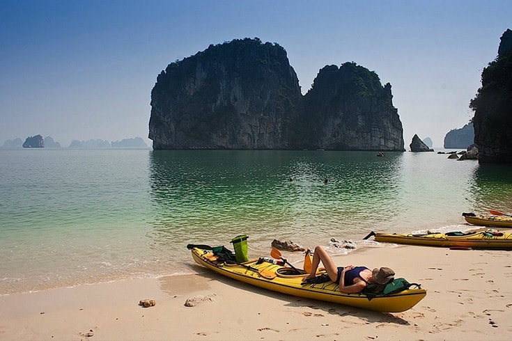 sunbathe on beach
