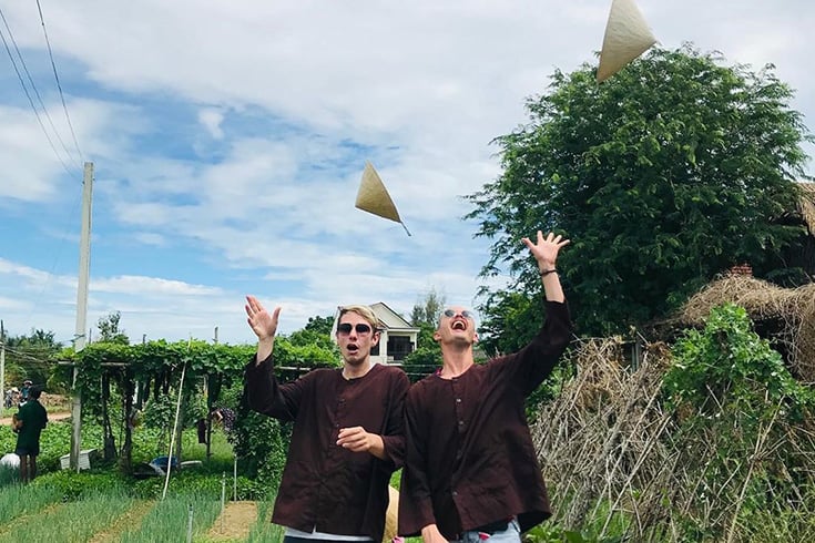 Tourists have fun in Tra Que Garden in Hoi An